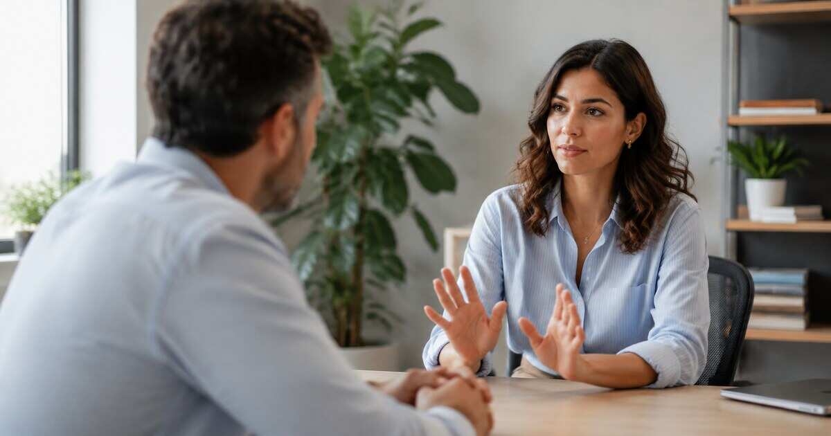 A professional discussing priorities and workload with a colleague
